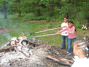 COOKING OVER THE FIRE AT THE RANCH